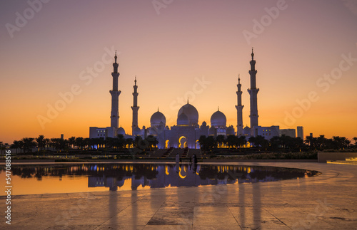 Tourists visit the Sheikh Zayed Grand Mosque. Night time view opposite the grand mosque. 