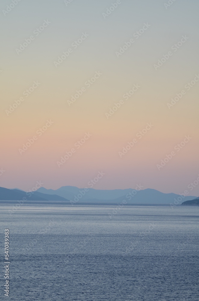 Sun is gone Dawn at Sea mountain silhouette colorfull Ocean Horizon
