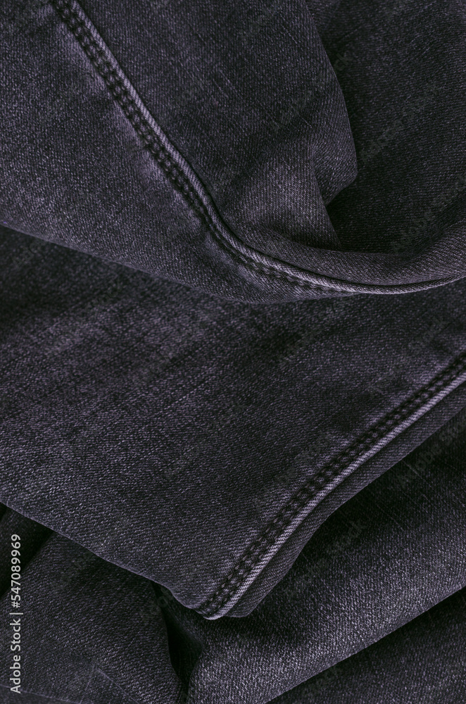 Part of dark jeans.