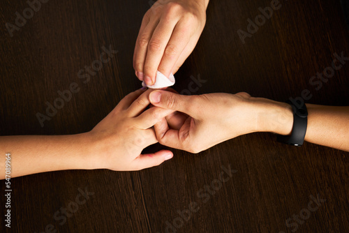 Woman hands using cotton wool  close-up
