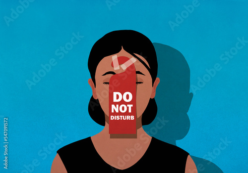 Do Not Disturb sign taped on face of tired woman
 photo
