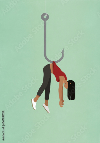 Woman dangling from fishing hook
 photo