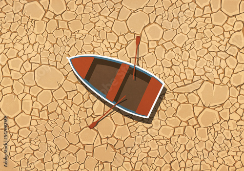 Abandoned rowboat stranded on dry, cracked land
 photo