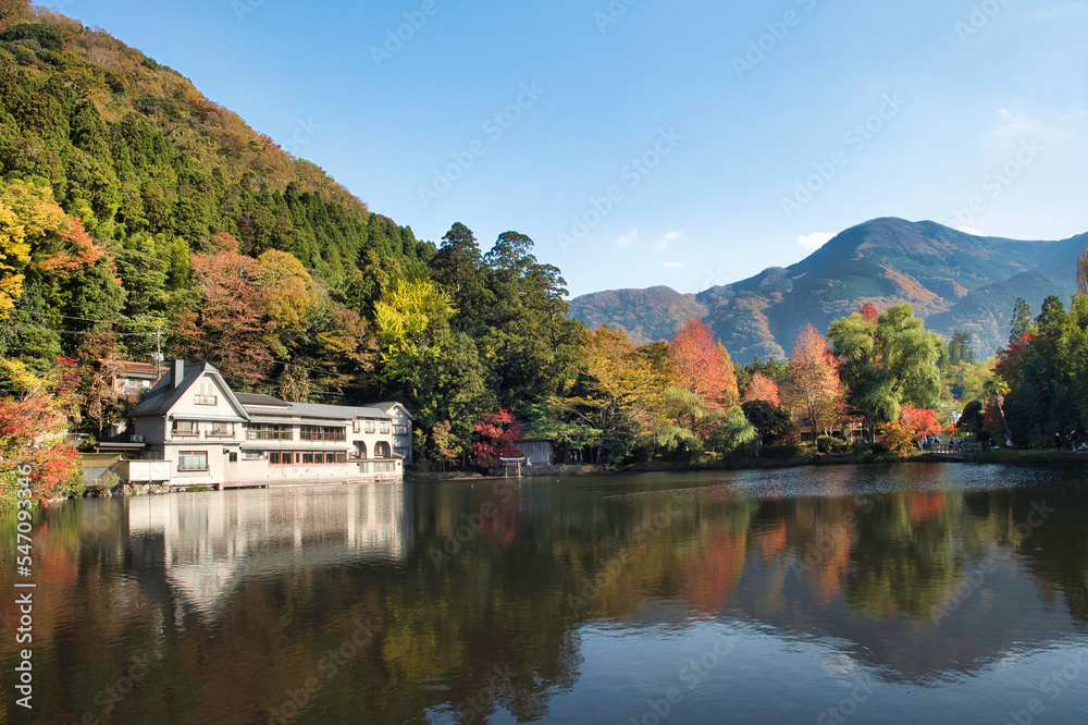 The reflection of Lake Kinrinko with Yufudake and Autumn leaves in Yufuin Town Oita, Japan