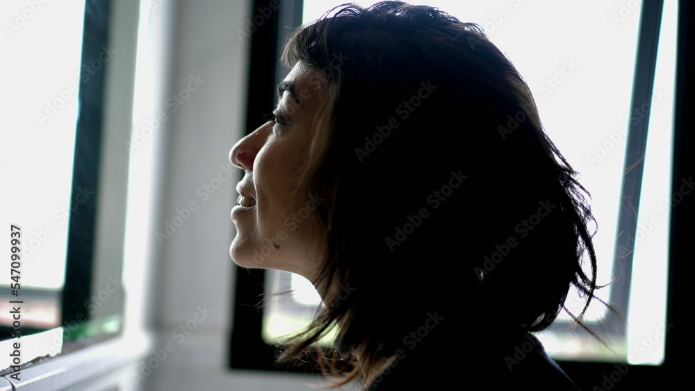 Hapyp hispanic woman looking at her own reflection standing in front of bathroom mirror smiling Hapyp hispanic woman looking at her own reflection standing in front of bathroom mirror smiling