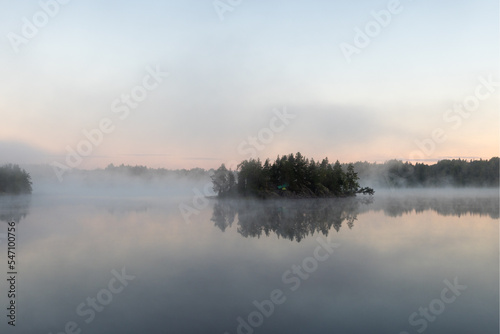 Fototapeta Naklejka Na Ścianę i Meble -  morning mist on a forest lake
