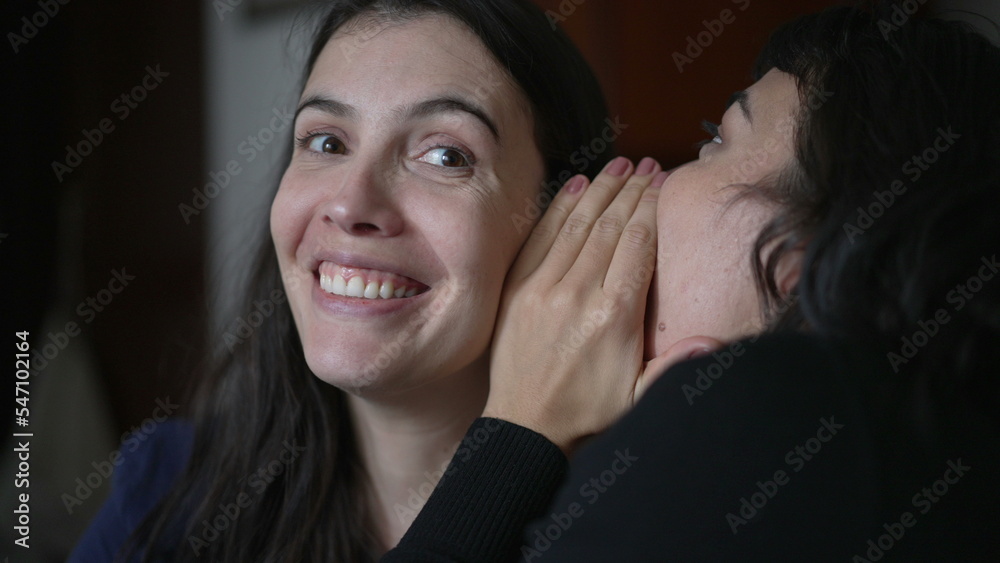 Friend telling secret to woman ear whispering. Young woman shock surprise reaction to gossip news. People sharing secrets