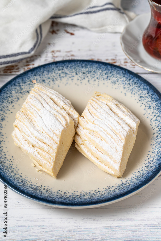 Flour cookies on a white wooden background. Mediterranean cuisine delicacies. Bakery desserts. close up