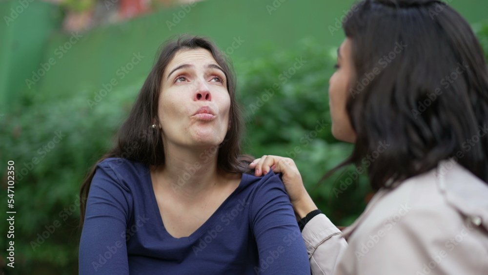 Depressed woman suffering with the help and support of female friend. Two women having EMPATHY. Sad person recovering from TRAUMA Depressed woman suffering with the help and support of female friend. Two women having EMPATHY. Sad person recovering from TRAUMA