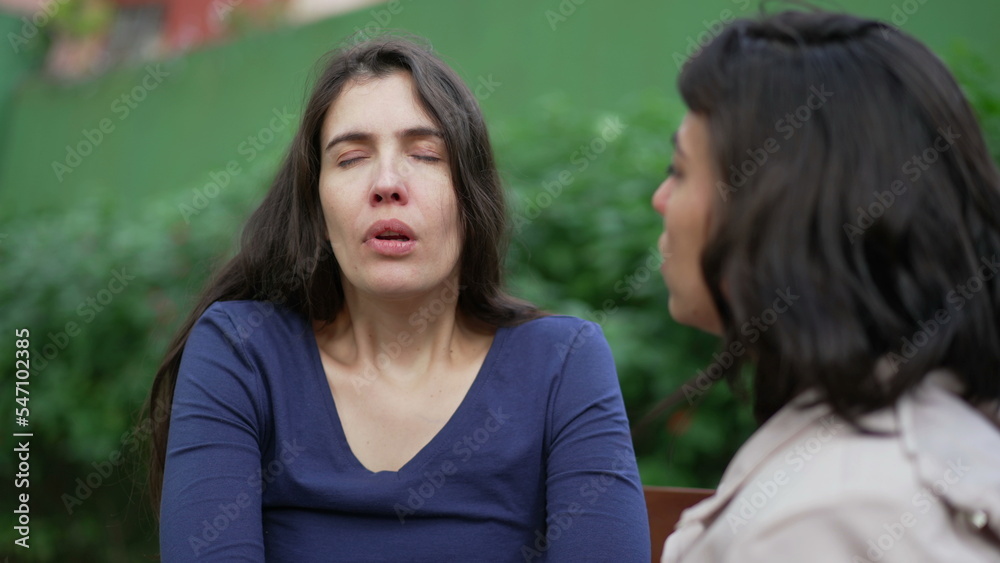 Depressed woman suffering with the help and support of female friend. Two women having EMPATHY. Sad person recovering from TRAUMA Depressed woman suffering with the help and support of female friend. Two women having EMPATHY. Sad person recovering from TRAUMA