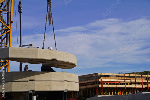 Folding crane mounting on a bridge construction site for the overpass of a service road over the future A143 motorway photo