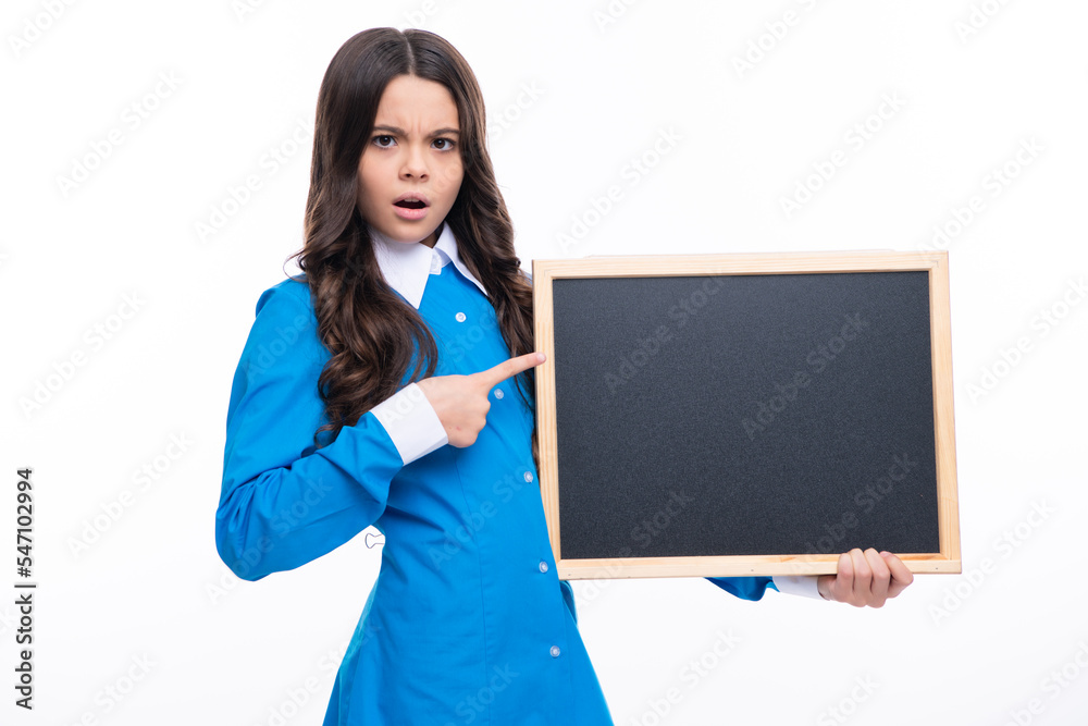 Teenage girl child holding blackboard, isolated on a white background. Excited face. Amazed expression, cheerful and glad.