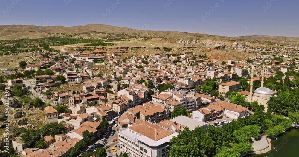 Avanos Turkey Aerial v4 low flyover kizilirmak river, charming townscape of yukari neighborhood with traditional turkish residential houses and narrow streets - Shot with Mavic 3 Cine - July 2022 Avanos Turkey Aerial v4 low flyover kizilirmak river, charming townscape of yukari neighborhood with traditional turkish residential houses and narrow streets - Shot with Mavic 3 Cine - July 2022