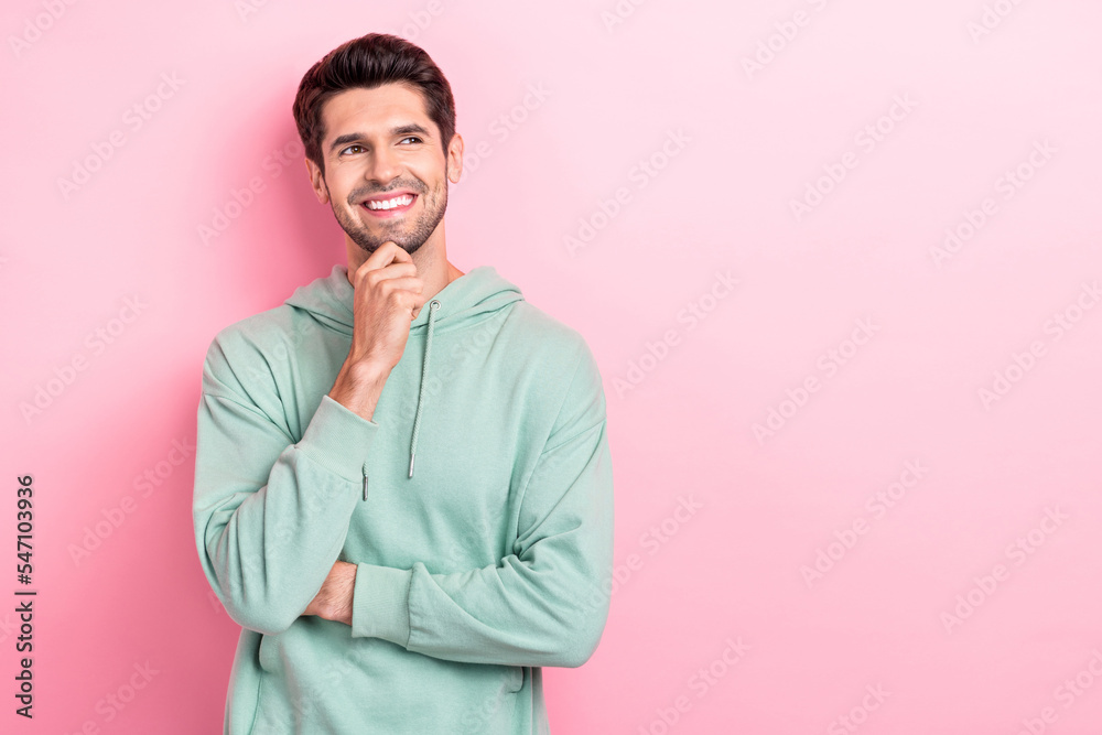 Photo of youngster positive guy macho dreaming about his salary next monday touching chin want buy new clothes empty space isolated on pink color background Photo of youngster positive guy macho dreaming about his salary next monday touching chin want buy new clothes empty space isolated on pink color background