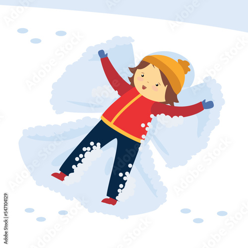 The boy makes an angel in the snow