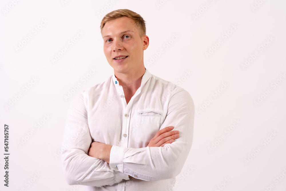 Caucasian businessman man in a white shirt smiling on a white background Caucasian businessman man in a white shirt smiling on a white background