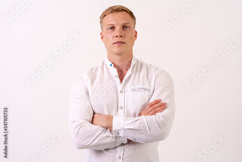 portrait of a caucasian businessman man in a white shirt on a white background © unai