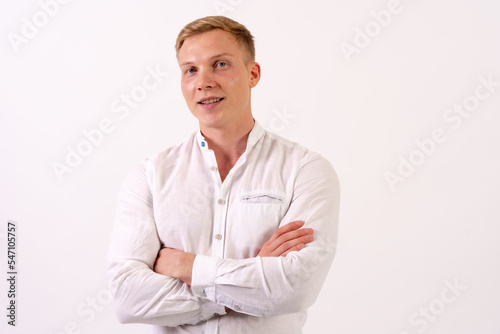 Caucasian businessman man in a white shirt smiling on a white background