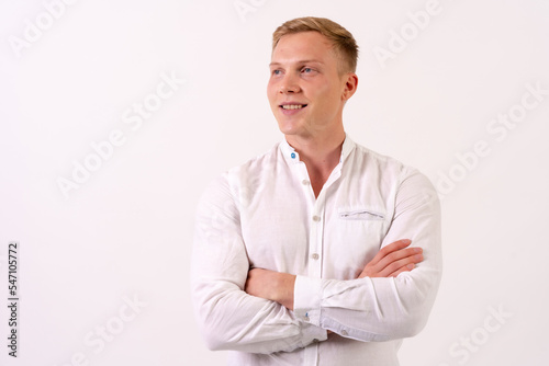 Caucasian businessman man in a white shirt smiling on a white background