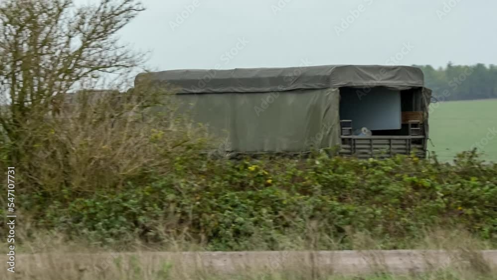 British army MAN SV 4x4 logistics lorry truck travelling at speed along a dirt track on a military exercise, Wilts UK British army MAN SV 4x4 logistics lorry truck travelling at speed along a dirt track on a military exercise, Wilts UK