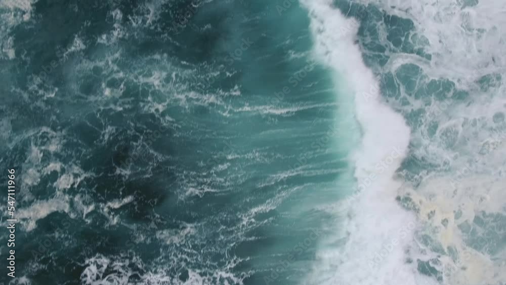 Huge waves coming to the coast line (shore) and breaking on underwater reef rocks. Crash is so powerful that white water appears. Huge waves coming to the coast line (shore) and breaking on underwater reef rocks. Crash is so powerful that white water appears.