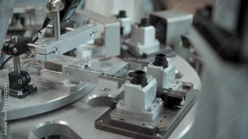 Robotic arm working in a production line Robotic arm working in a production line