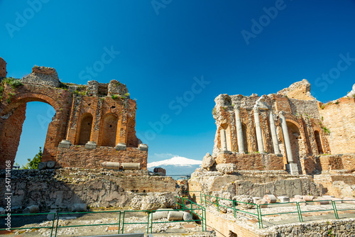 Taormina, Sicily. View of town, theater and Etna