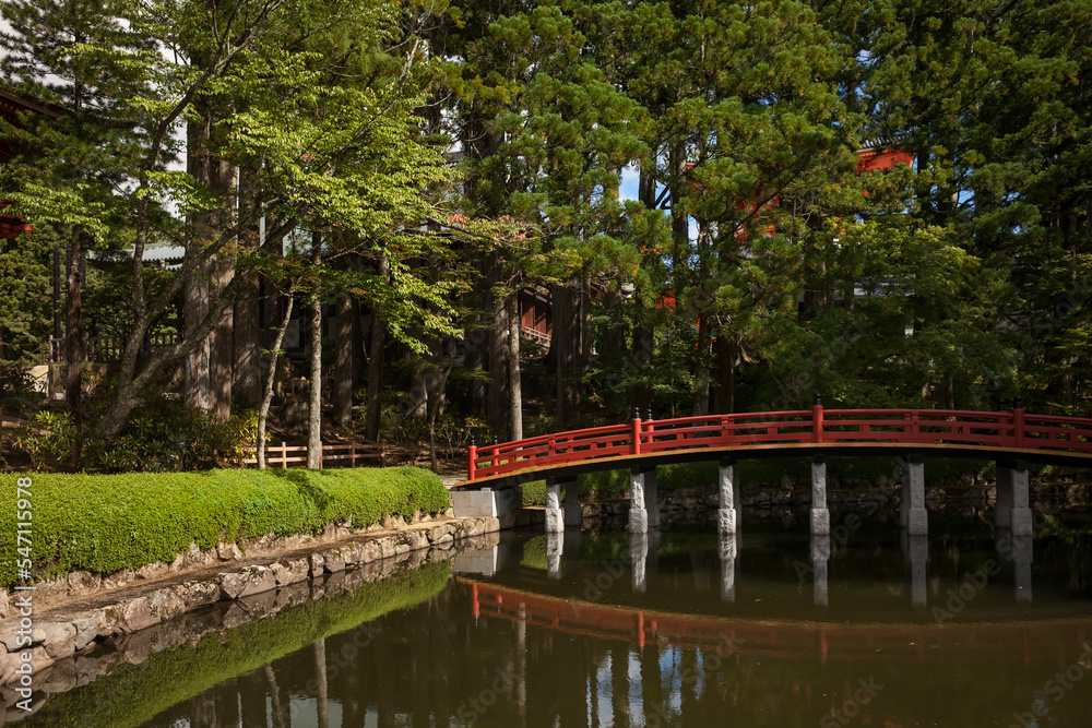 Traditional Japanese red bridge over Lotus Pond in Koyasan