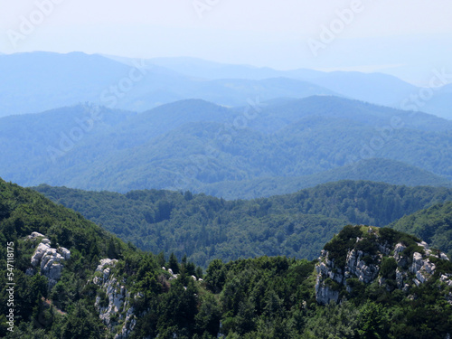 View of distant hills and mountain forests of Gorski Kotar from Risnjak National Park, Croatia (Pogled na udaljene brijegove i planinske šume Gorskog kotara iz nacionalnog parka Risnjak - Gorski kotar photo