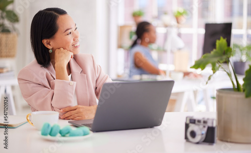 Asian woman, thinking and laptop in startup, small business or photography agency with smile. Digital creative photographer and office pc with vision, dream or happiness in for inspiration at job