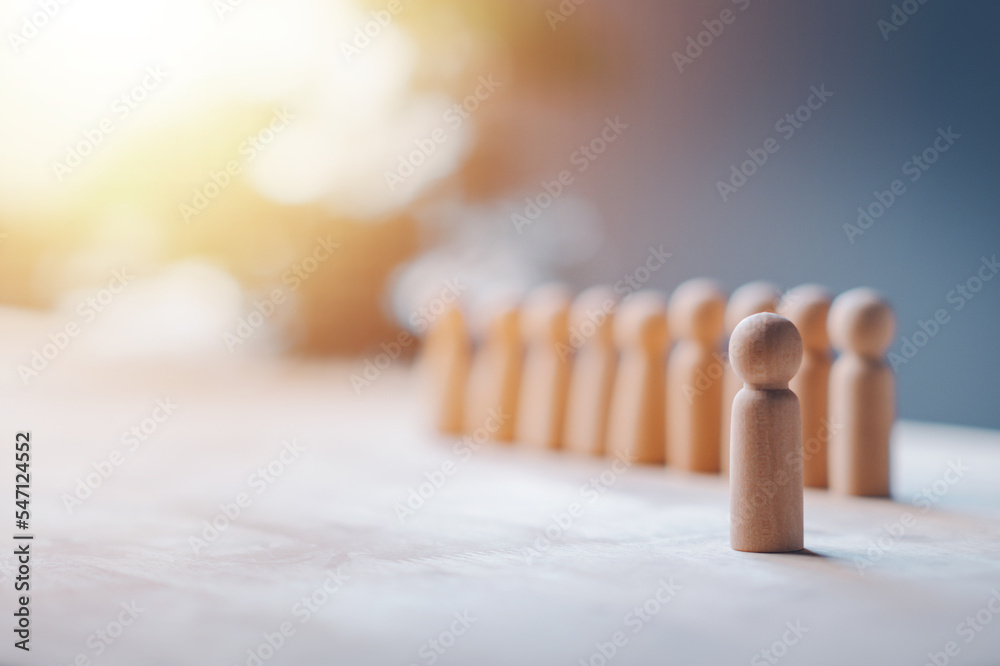 HR manager (human resources) or Employer. Person wooden doll is leader stands out from crowd. Looking for good worker. HR, HRM, HRD concepts. HR manager (human resources) or Employer. Person wooden doll is leader stands out from crowd. Looking for good worker. HR, HRM, HRD concepts.