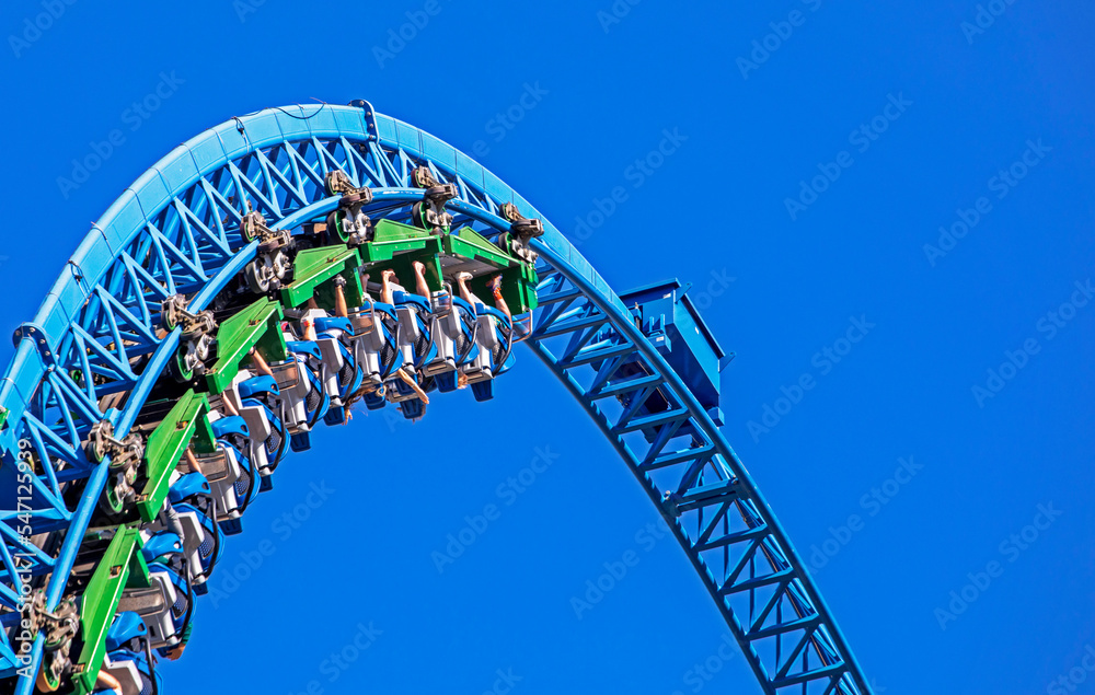 extreme rollercoaster arc on blue sky background. attractions extreme rollercoaster arc on blue sky background. attractions
