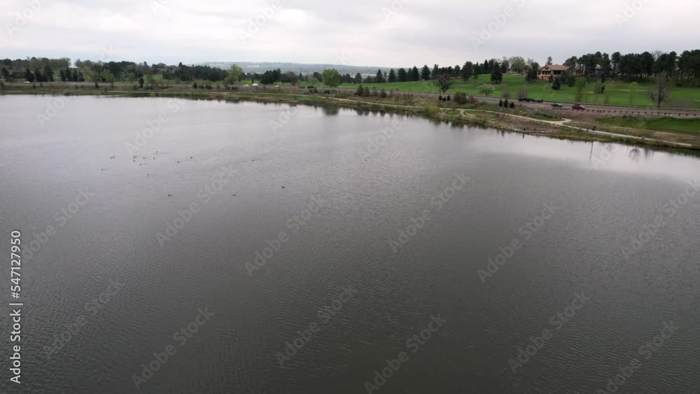 Aerial drone shot of Berkeley Lake near a highway in Colorado, Denver Aerial drone shot of Berkeley Lake near a highway in Colorado, Denver