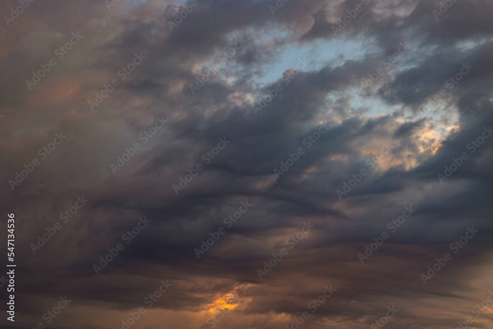 Dramatic or cinematic cloudscape at sunset or sunrise.