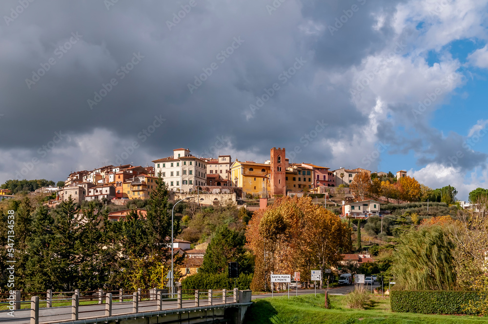 Santa Maria a Monte, Pisa, Italy, with autumn colors under a dramatic sky