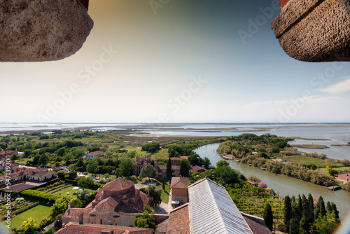 Torcello, Venezia. Panorama della Laguna con tetto della basilica di Santa Maria e chiesa di Santa Fosca dalla Torre dell' Isola photo