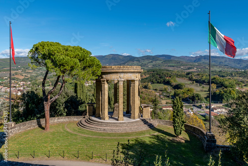 The monument to the fallen of all wars in the historic center of Poppi, Arezzo, Italy, on a sunny day photo