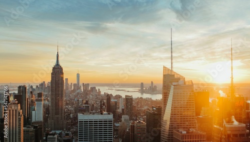 Empire State Building New York City skyline sunset from Top of The Rock golden city view