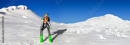 Sexy woman in silver cosmic outfit silver and winter boots is posing in the mountains. Female model in glamour silver jumpsuit in winter scenery. photo