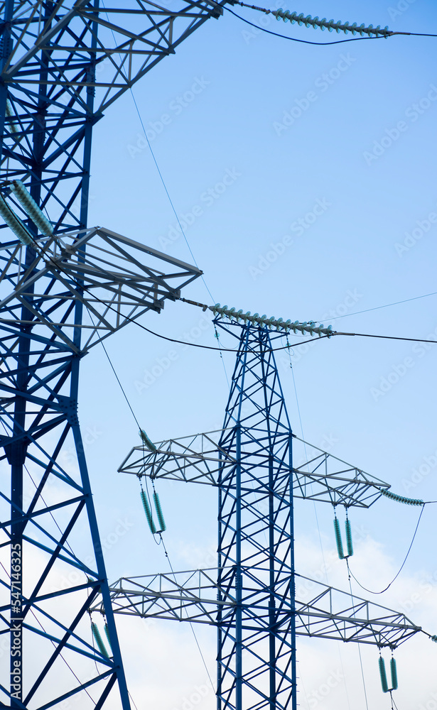 Power lines against the blue sky Power lines against the blue sky