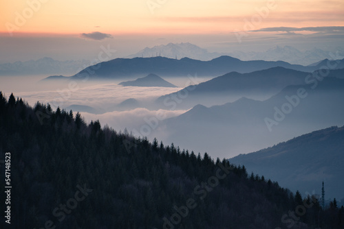 Layers of hills in the bacground and low altitude clouds during dusk, Northern Italy