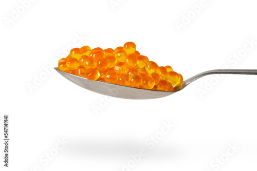 Red caviar in the silver spoon isolated on a white background with clipping path. Close up. Macro.