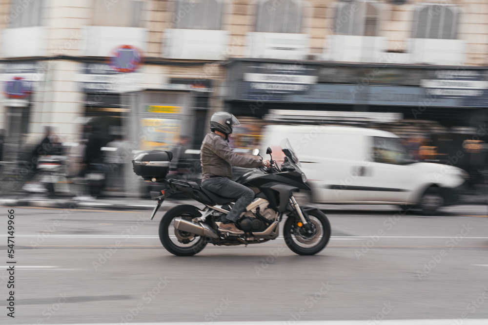 Man driving a scooter in the city