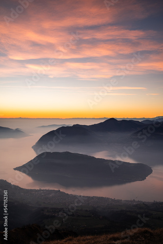 Beatiful pink clouds during sunset at Punta Almana, with the famous Montisola in the background, Northern Italy photo