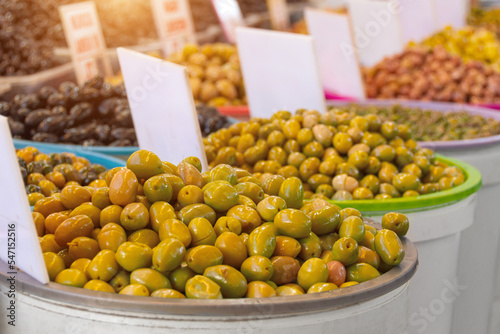 Olives marinated in containers on the sale of the market.