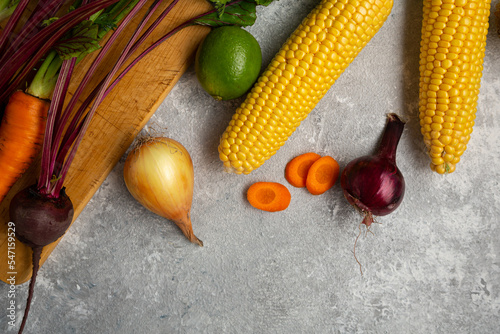 Cooking food concept carrots beer top view sweet corn fresh vegetables top view photo