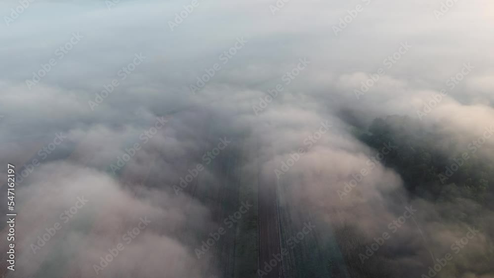 Aerial top view over the fog, in the Romanian countryside Aerial top view over the fog, in the Romanian countryside