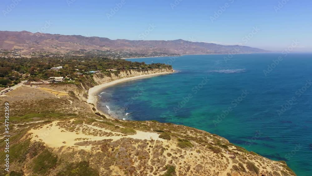 Aerial drone shot of the famous point Dume state beach in Malibu, California on a sunny summer day. Crystal clear turquoise ocean. Aerial drone shot of the famous point Dume state beach in Malibu, California on a sunny summer day. Crystal clear turquoise ocean.