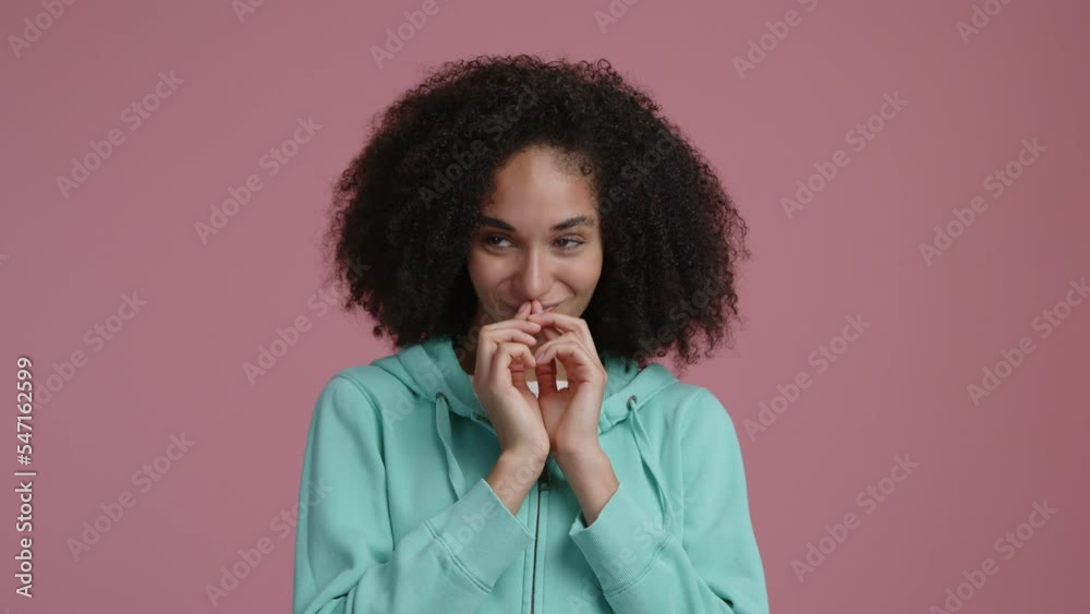 Young, brunette making silly gestures with her fingers. Beautiful, cheerful woman in her 20s wearing casual clothes and smiling. High quality 4k footage Young, brunette making silly gestures with her fingers. Beautiful, cheerful woman in her 20s wearing casual clothes and smiling. High quality 4k footage
