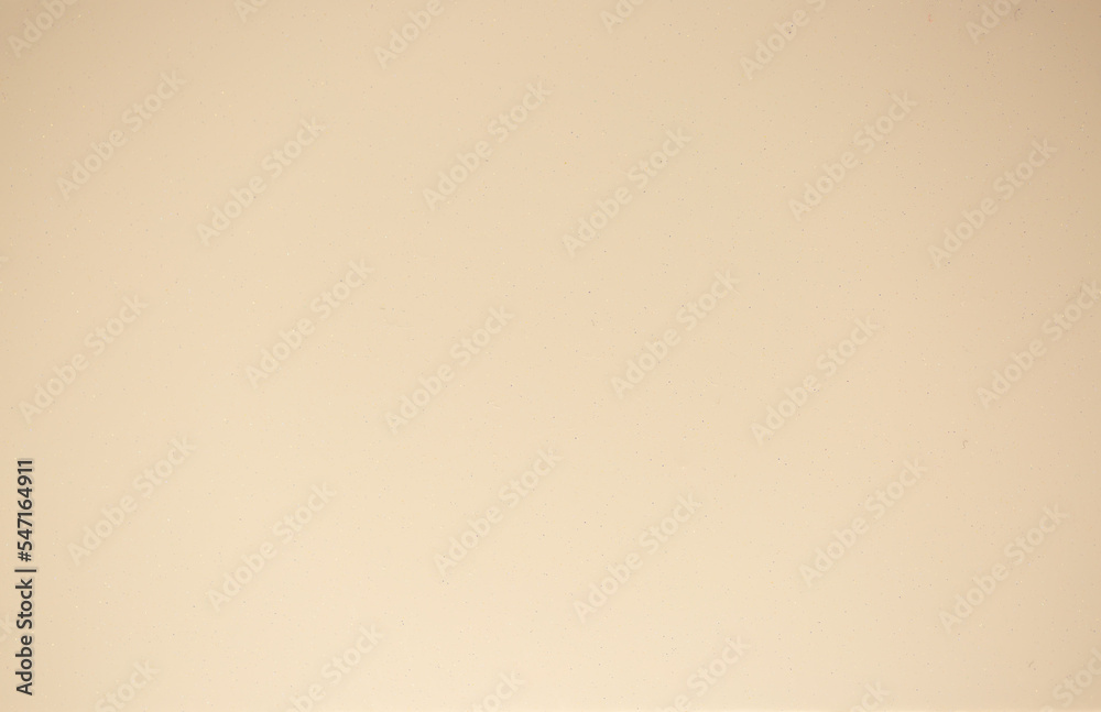 Brown background from decorative plaster with abstract spots. Unusual beige wall texture with beautiful patterns, creative surface background. Front covering for facing of buildings.